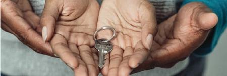 New homeowner holding house key